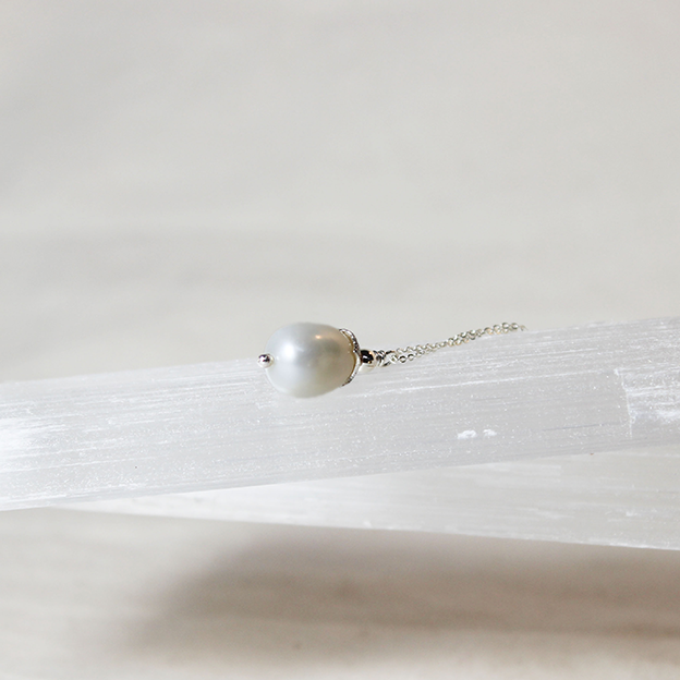 Tipa Levana (White Drop) Pearl necklace on reticulated silver cup and silver chain